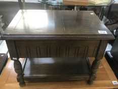 An oak sewing work table and contents including cottons etc.