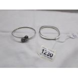 2 silver bangles.