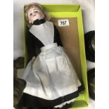 A German bisque headed doll with original clothing