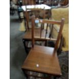 A pair of oak chairs.