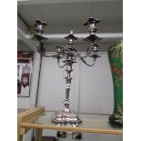 A 4 branch Sheffield plate candelabra with snuffer.