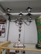 A 4 branch Sheffield plate candelabra with snuffer.