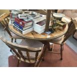 A circular dining table and 4 chairs