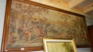 An oak framed large Flemish tapestry depicting a rural scene outside village inn. 74.