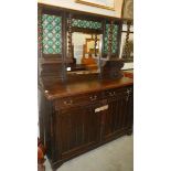 A dark oak mirror backed sideboard/dresser.