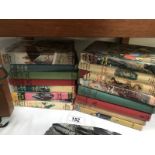 A collection of Enid Blyton books including Famous Five some early editions