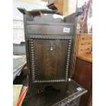 An oak coal cabinet with liner.
