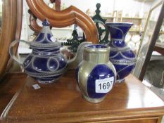 A blue pottery teapot and 2 vases.