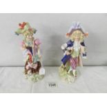 A pair of 19th century porcelain figures with crossed swords mark, 20 cm tall.