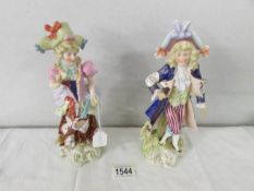A pair of 19th century porcelain figures with crossed swords mark, 20 cm tall.