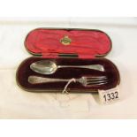 A cased silver spoon and fork, 52 grams.