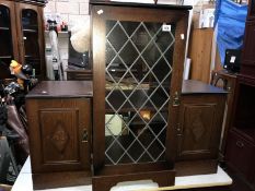 A glazed front HiFi cabinet with 2 smaller storage cabinets