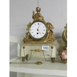 A French mantel clock on onyx base and surmounted figure. (not working).
