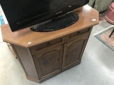 A dark wood stained 2 drawer 2 door hall cupboard