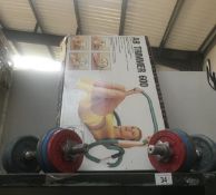 An AB trimmer 600 with a pair of dumbbells