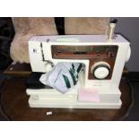 A Singer sewing machine with case