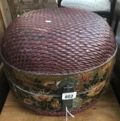 A large oriental hand painted wicker basket