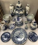 16 items of blue and white Delft including lidded vases, jug etc.