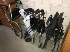 A wheelchair & 3 mobility walkers