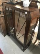 An art deco oak display cabinet