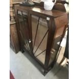 An art deco oak display cabinet