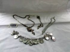 3 white metal necklaces and a bracelet.