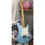 A blue rock electric guitar