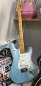 A blue rock electric guitar