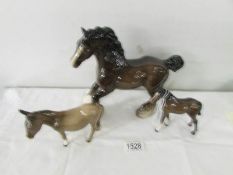 A Beswick horse, a Beswick foal and a Beswick donkey.