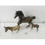 A Beswick horse, a Beswick foal and a Beswick donkey.