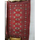 A red patterned rug,.