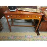 A 3 drawer mahogany side table.