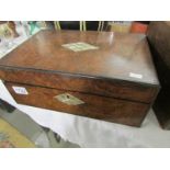 A mahogany writing box with mother of pearl inlay.