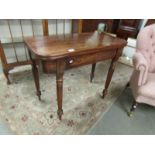 A mahogany fold over tea table.