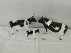 A Beswick Bull, a Beswick cow and a Beswick calf.