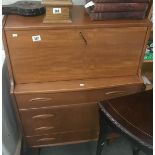 A modern teak bureau