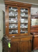 An oak 2 door glazed top bookcase.