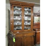 An oak 2 door glazed top bookcase.