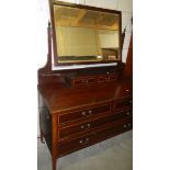 A mahogany inlaid dressing table.