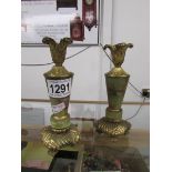 A pair of onyx and gilt candlesticks.