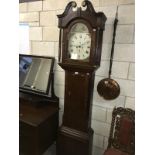 An oak 8 day Grandfather clock.