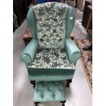 A new upholstered armchair with button footstool