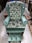 A new upholstered armchair with button footstool