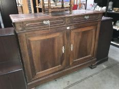 A large sideboard with 2 drawers and 2 doors