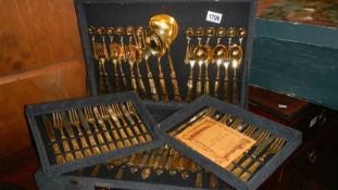 A gold plated cutlery set.
