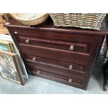 A dark brown chest of 3 drawers