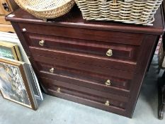 A dark brown chest of 3 drawers