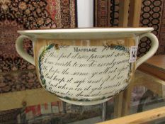A Sunderland motto ware chamber pot relating to marriage.