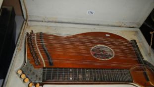 A 36 string concert zither by Hans Haubner, Marianbad, German with case.