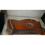 A 36 string concert zither by Hans Haubner, Marianbad, German with case.